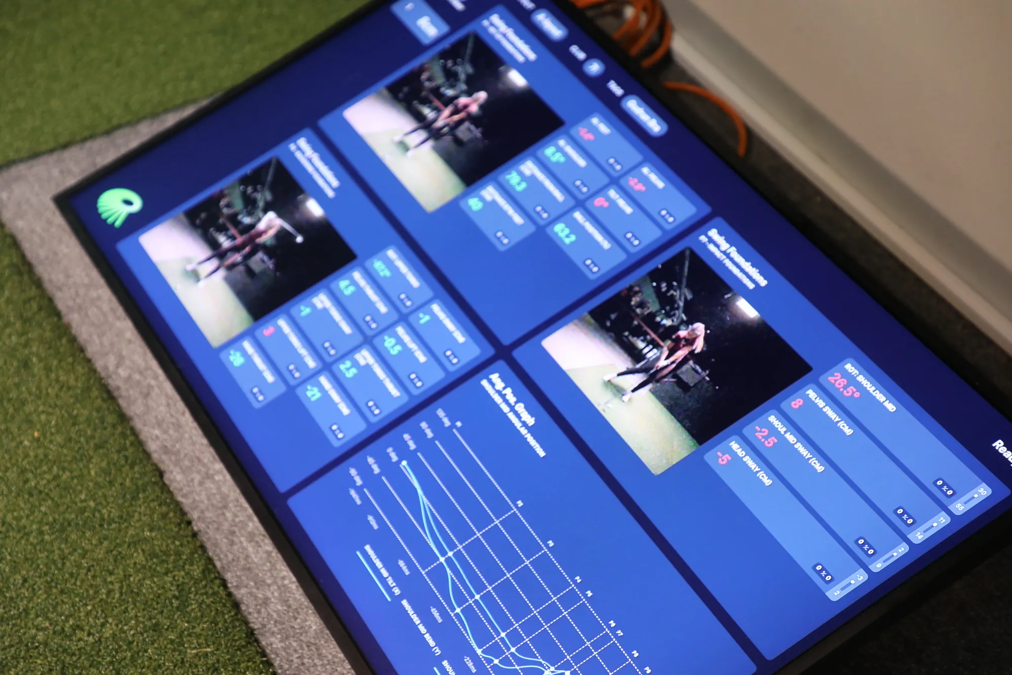 Coach reviewing swing feedback